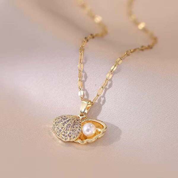 Pendentif coquillage perle doré