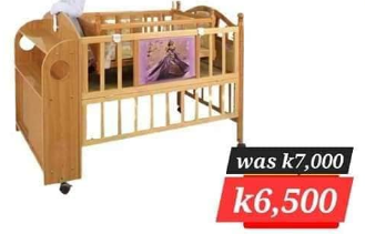 light brown wooden crib