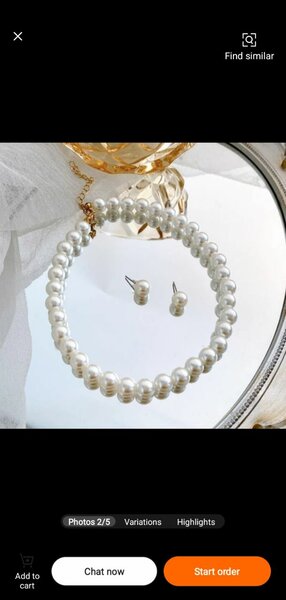 Pearl necklace with earrings and a hand piece