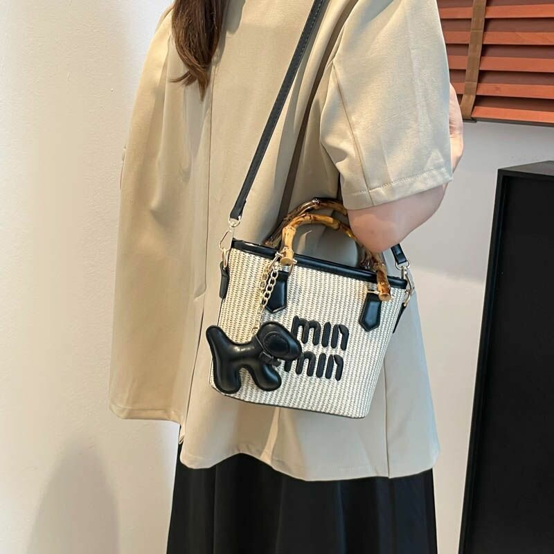 Chic Woven Handbag with Dog Charm