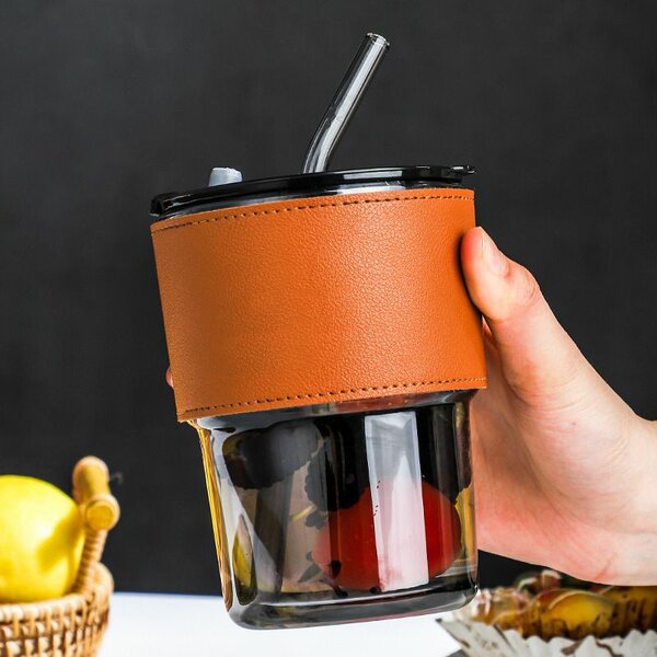 Glass cup with straw