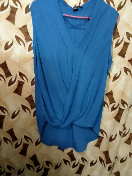Blouse élégante sans manches